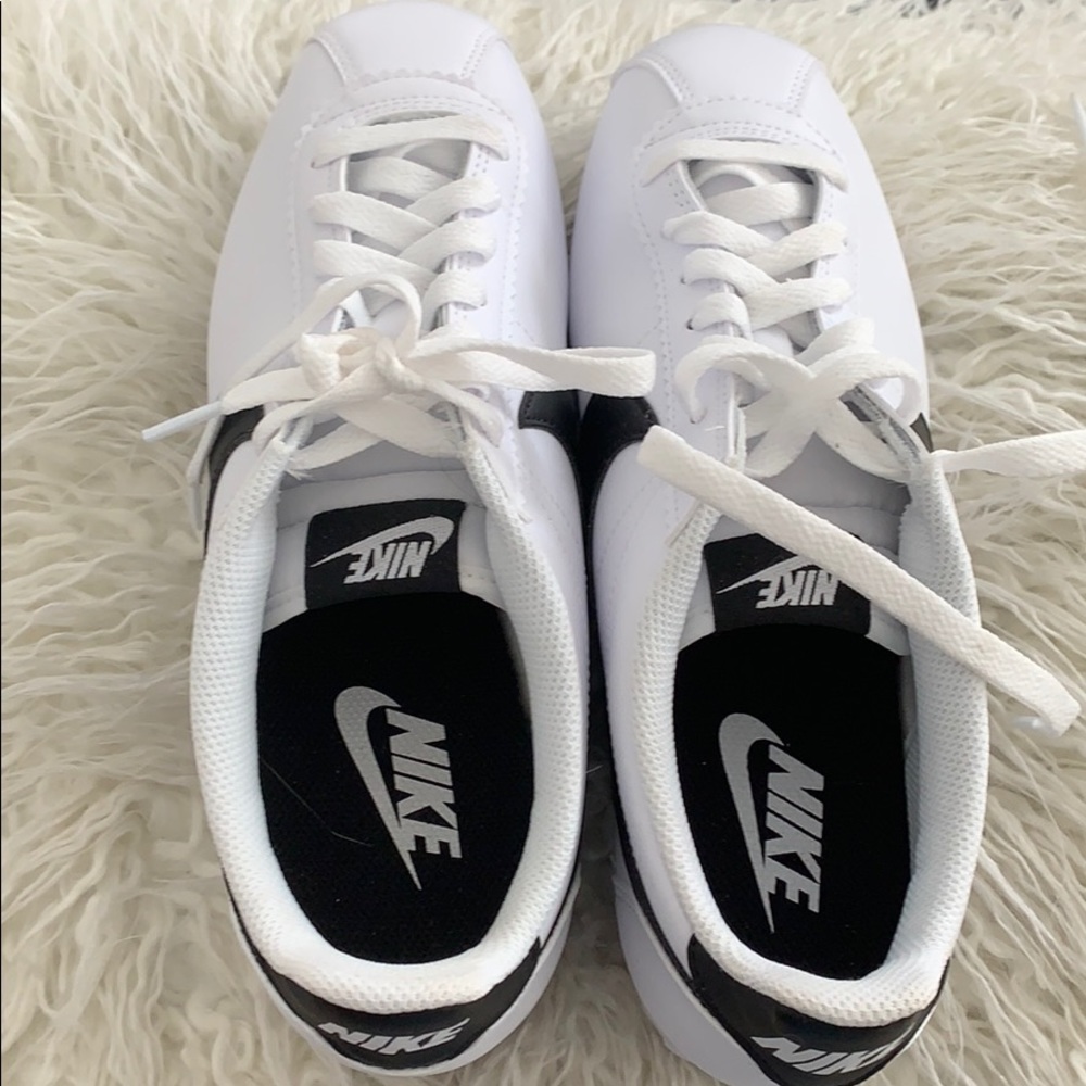 White and black nike shoe